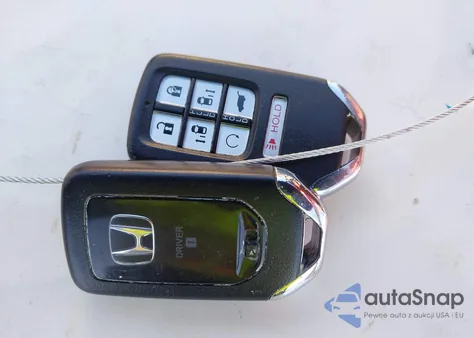 2021 Honda Odyssey Touring z USA, uszkodzony, nr VIN 5FNRL6H81MB039764